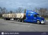 large-empty-wire-spools-being-transported-on-bed-of-semi-truck-at-GKPW3T.jpg